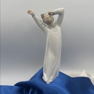 Lladró sculpture “Boy Awakening" (also commonly referred to as "Boy Yawning").